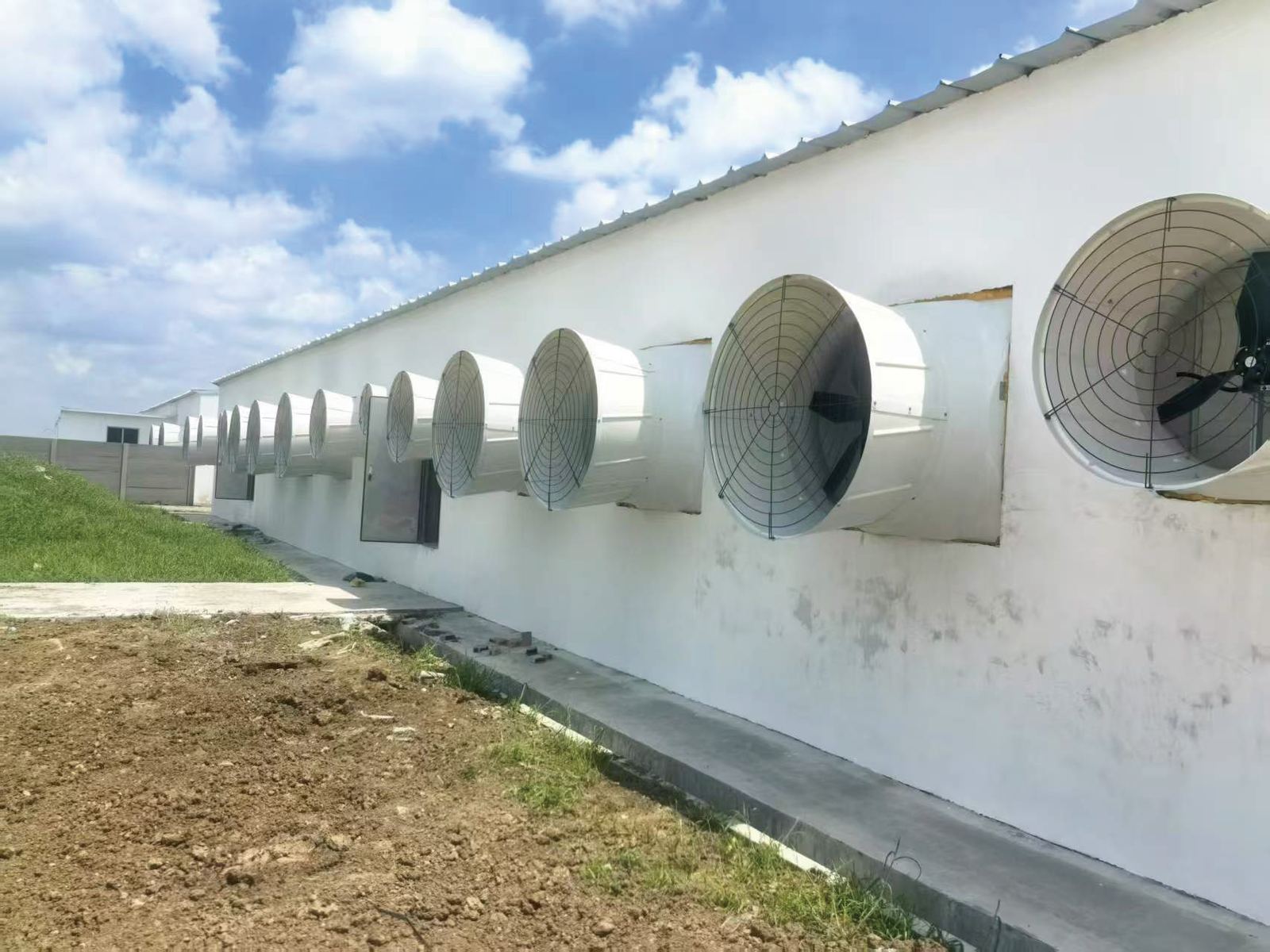 Cone exhaust fans on a barn wall
